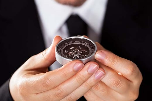 professional man holding a compass