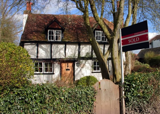 UK cottage with sold sign outside